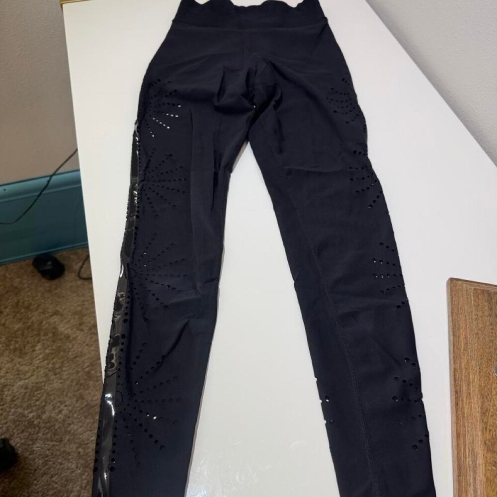Ultracor Black leggings with perforated side panels and reflective stripes, size